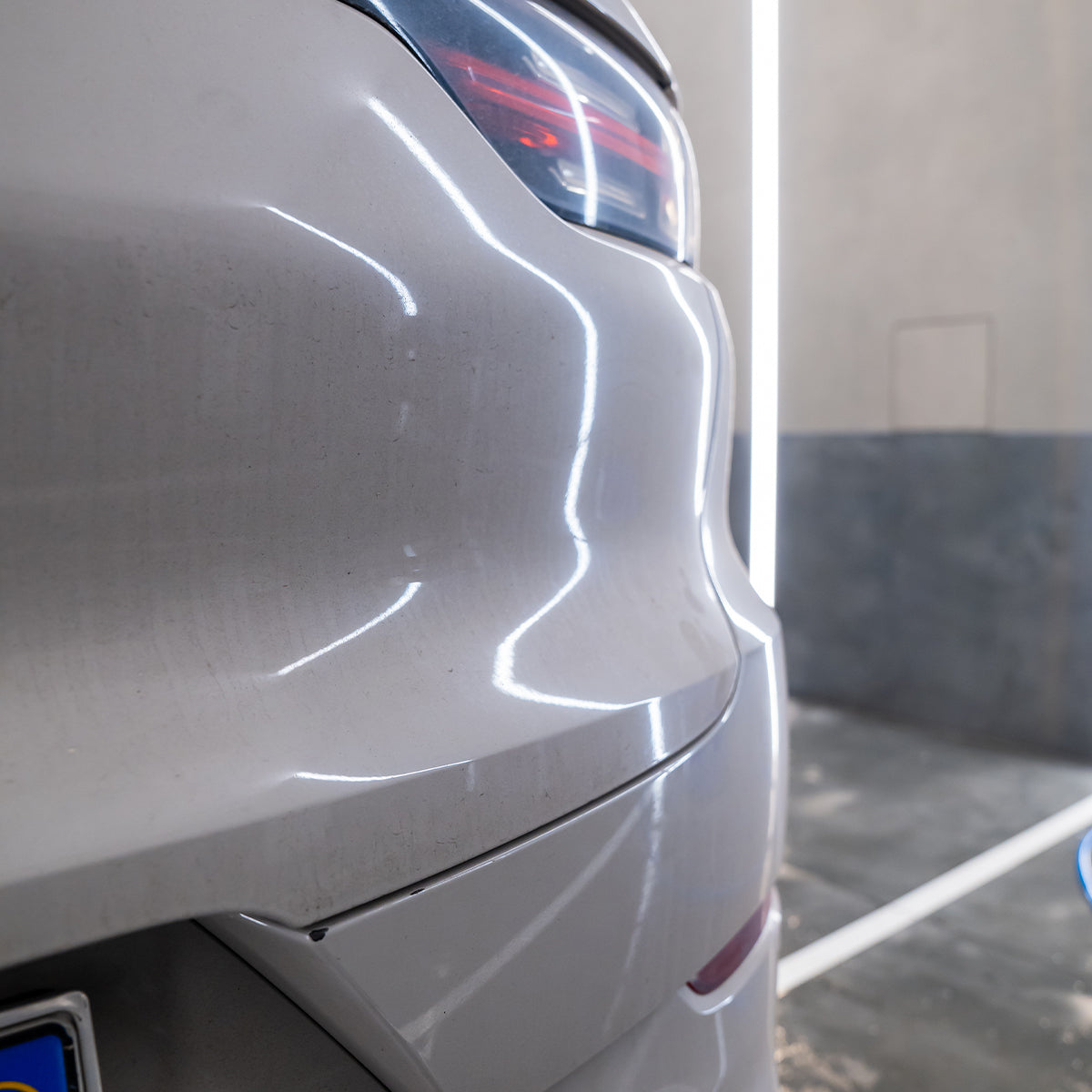 Close-up of a car&#39;s rear end with a blurred background
