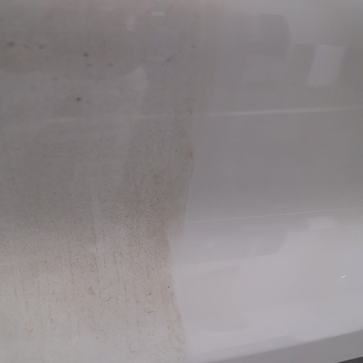 Close-up of a white surface with a visible stain